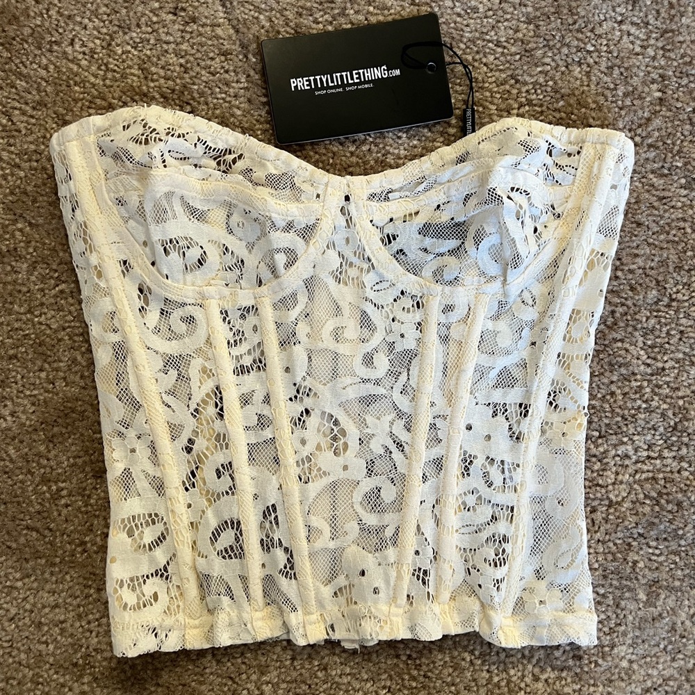 Never worn, tags still on, white lace corset top